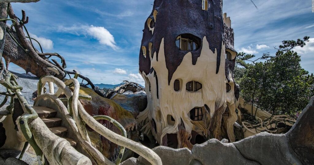 Tree-shaped house amidst roots and trees